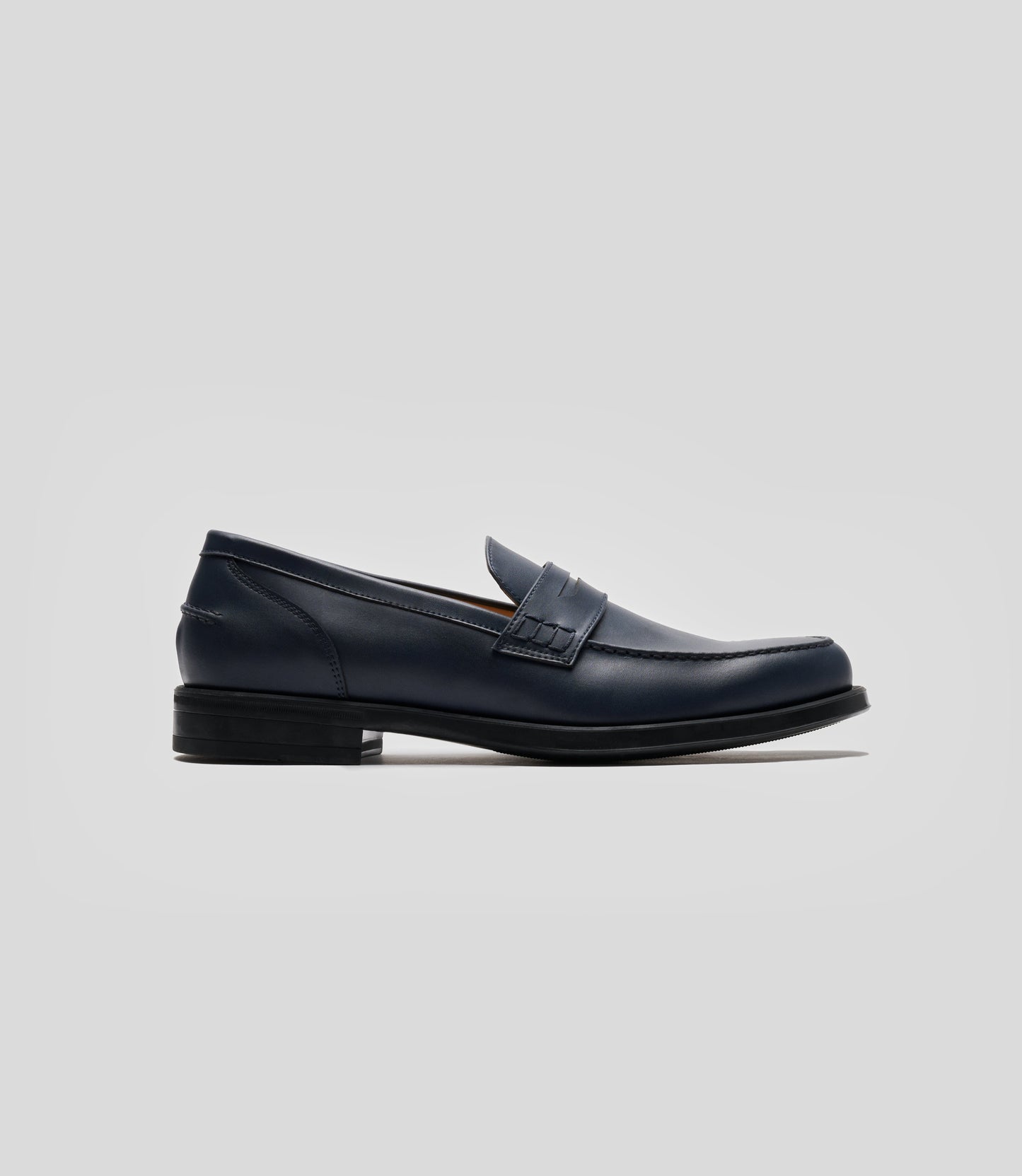 Vegan Loafer - Man, stylish navy shoe featuring blake construction and U-shaped stitched pattern.