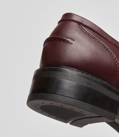 Vegan Loafer - Woman showcasing the heel and blake construction for a stylish, versatile shoe.