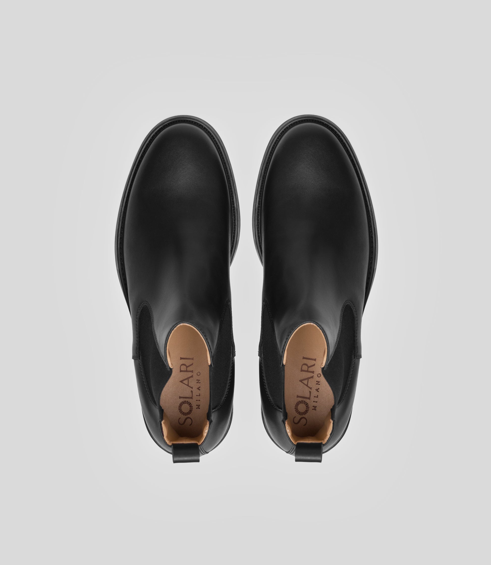 Vegan Chelsea Boot - Men, elegant black boots showing top view with a sleek design and stylish details.