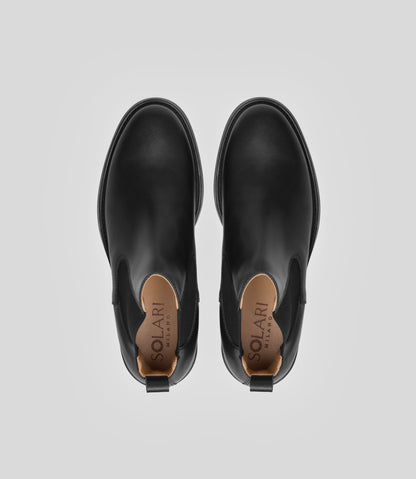 Vegan Chelsea Boot - Men, elegant black boots showing top view with a sleek design and stylish details.