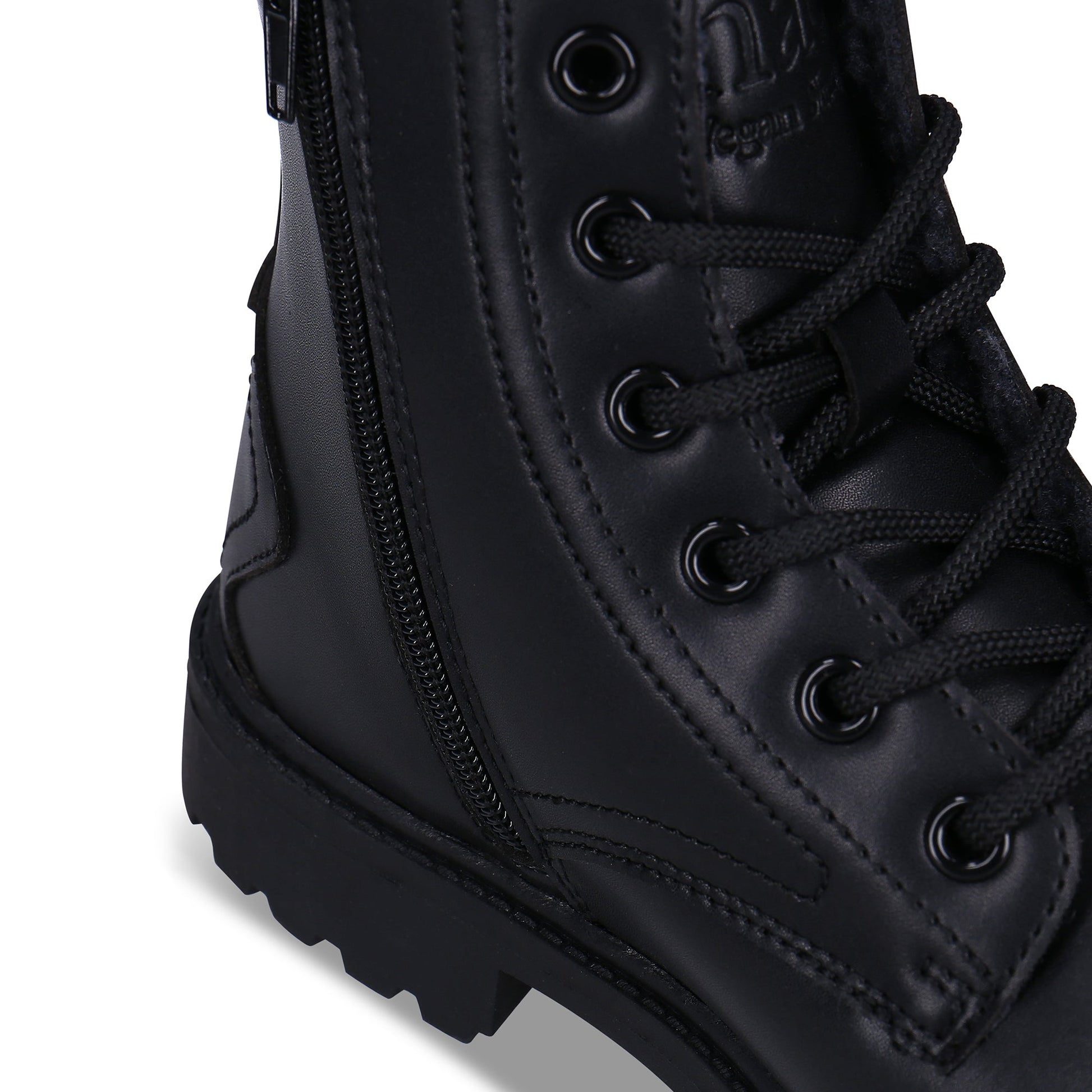 close view of vegan boots with logo engraved on the tongue and zipper | NAE